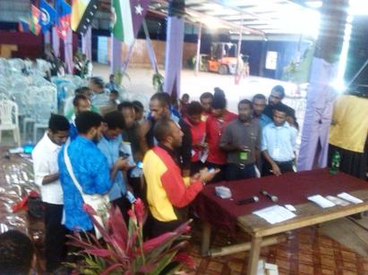 Students at Joseph Kingal Ministries download bibles via wifi bible box
